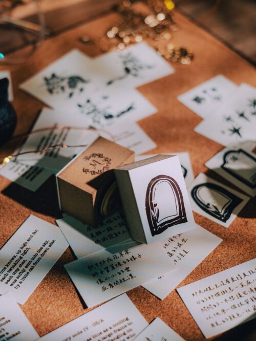 Collector Mr.M Tulip Arch stamp on a table with notes and decorations.