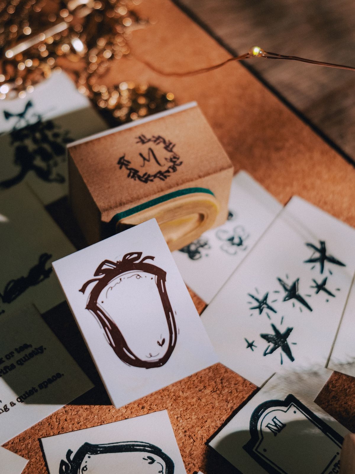 Collector Mr.M Ribbon Shield Stamp on cork board with designs.