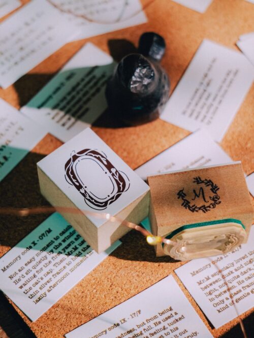 Collector Mr. M Tulip Oval stamp with wood handle on corkboard.