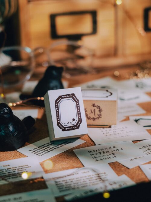 Collector Mr.M Tulip Octagonal stamp on a desk with notes.