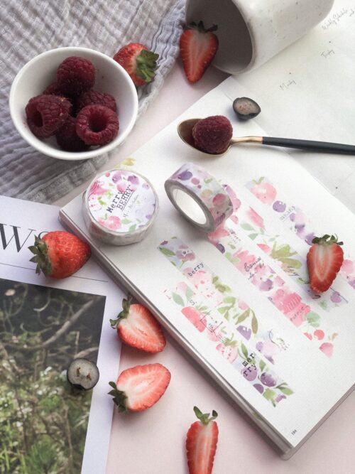 Merry Berry Washitape with berry designs on a planner surrounded by berries.