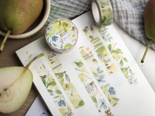 Slice a Pear Washitape with pear and floral design on a notebook.