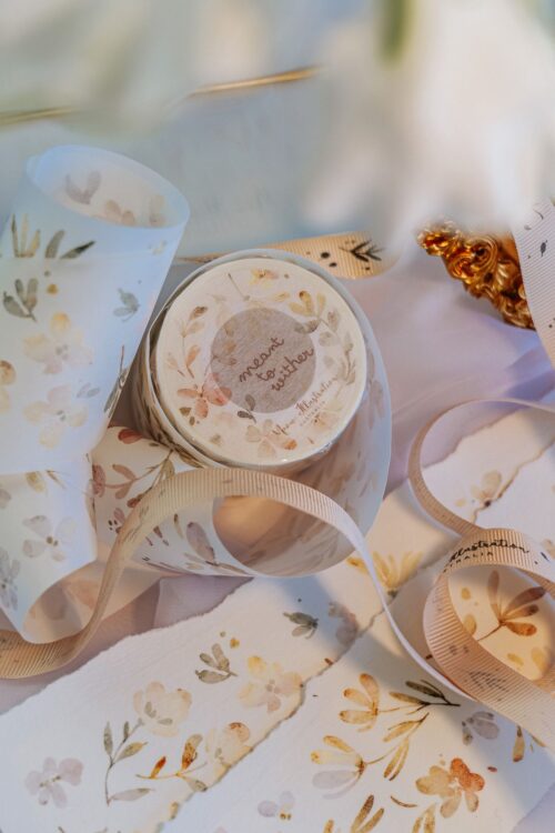 Meant to Wither washi tape with floral pattern on a decorative setup.