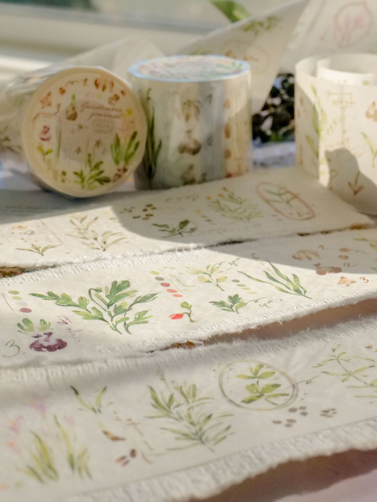 Gardeners Journal Washi-Tape with botanical designs on a roll.