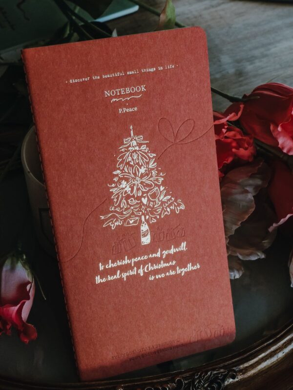 P.Peace letterpress notebook with textured paper and Christmas theme.