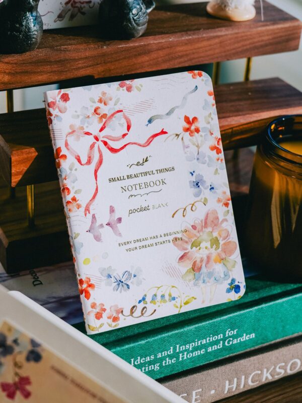 Gold Foil Passport Notebook with flower girl peach design and gold detailing.