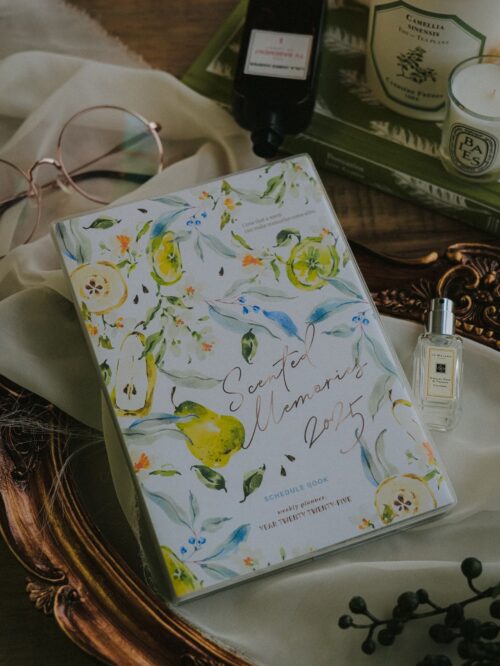 2025 Scented Memories Weekly Planner with watercolor cover and gold foil accents.