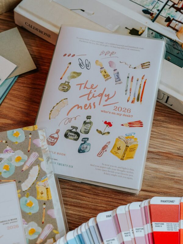 2026 Tidy Mess desk planner with colorful stationery illustrations.