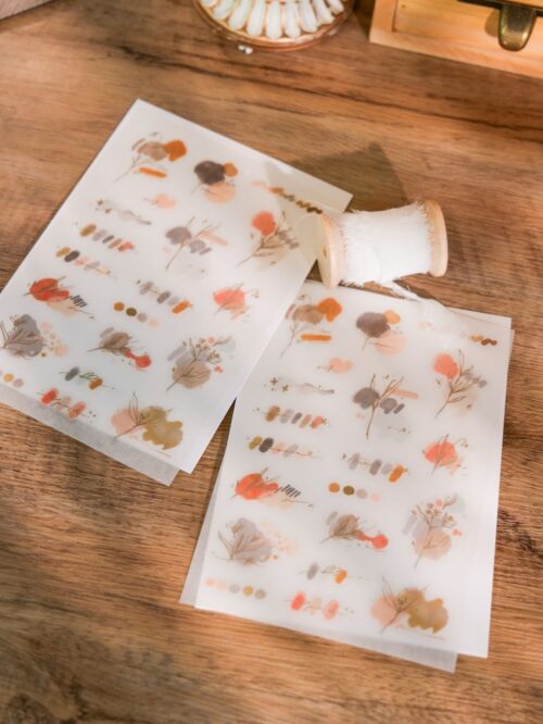 Rosewood Transfer Stickers with floral designs on a wooden surface.