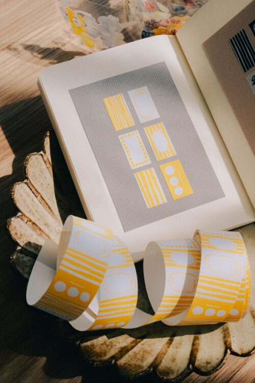 Yellow PaperNote sticker label roll with 500 writable labels.