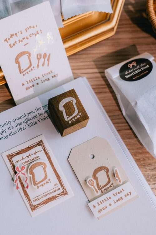 Dyed beech wood stamp with bread design, ideal for crafting.