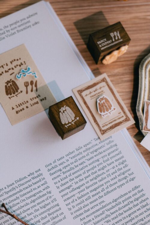 Fancy a Cuppa Dyed Beech Wood Stamp with Canele design on a book.