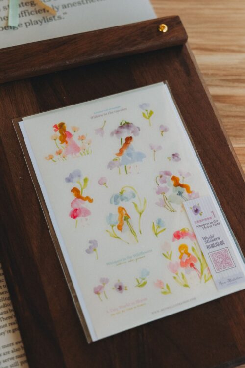 Whispers in the Flower Field 1 Washi Sticker on wooden board.