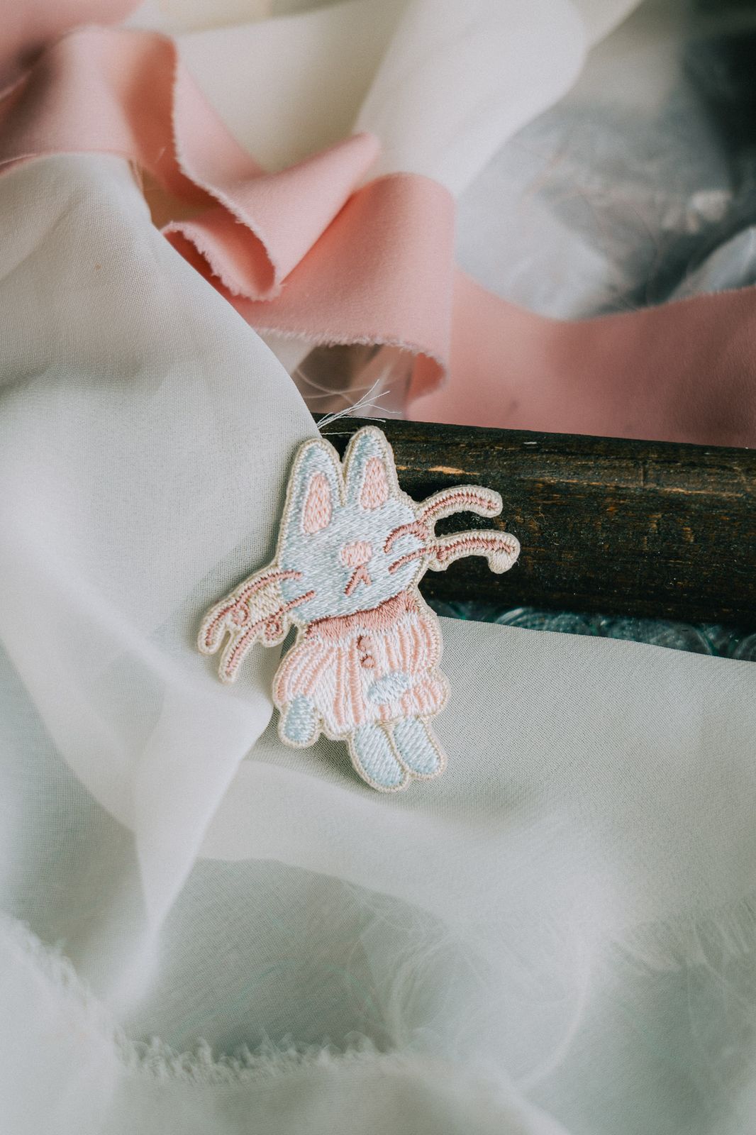 Pink Magician Cat embroidered pin with silver backing, 4.6 x 5 cm.