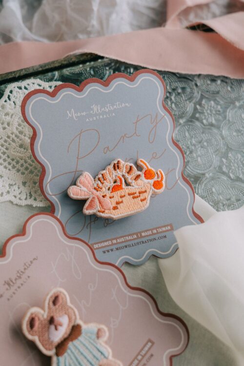 Berry and Picnic Basket Embroidered Pins with silver pin accessory.
